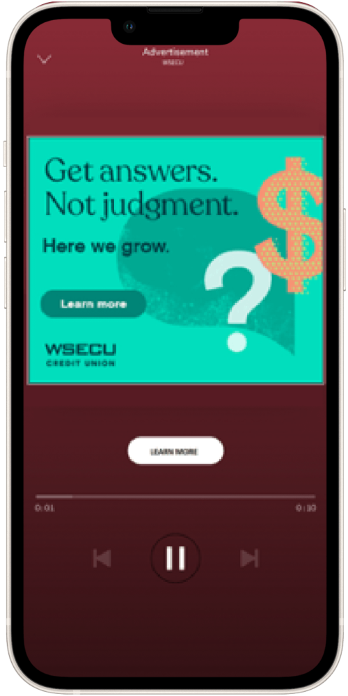 Mobile advertisement for WISECU Credit Union featuring a turquoise background with text promoting financial guidance without judgment. The design includes a dollar sign, a question mark, and a call-to-action button labeled "Learn more."