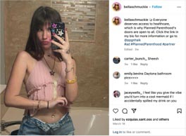 Young woman taking a selfie in a bathroom, wearing a pink cropped top and denim shorts, promoting access to healthcare and Planned Parenthood.
