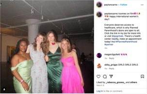 Three women posing together at a social event, wearing elegant dresses in green, silver, and pink. The setting features industrial décor with soft lighting, creating a festive atmosphere.