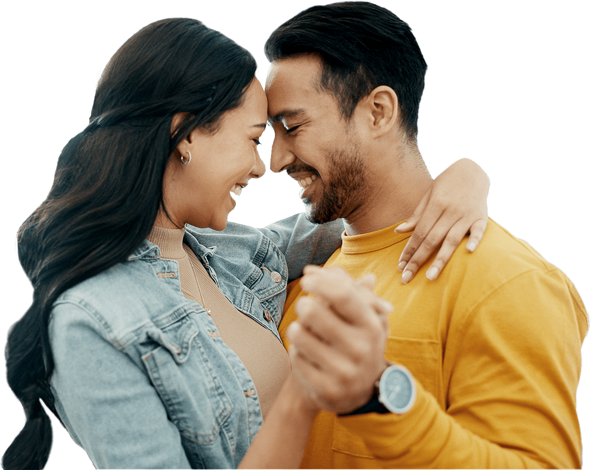 Couple smiling and dancing closely, showcasing joy and connection, with a focus on their intimate moment and playful expressions.