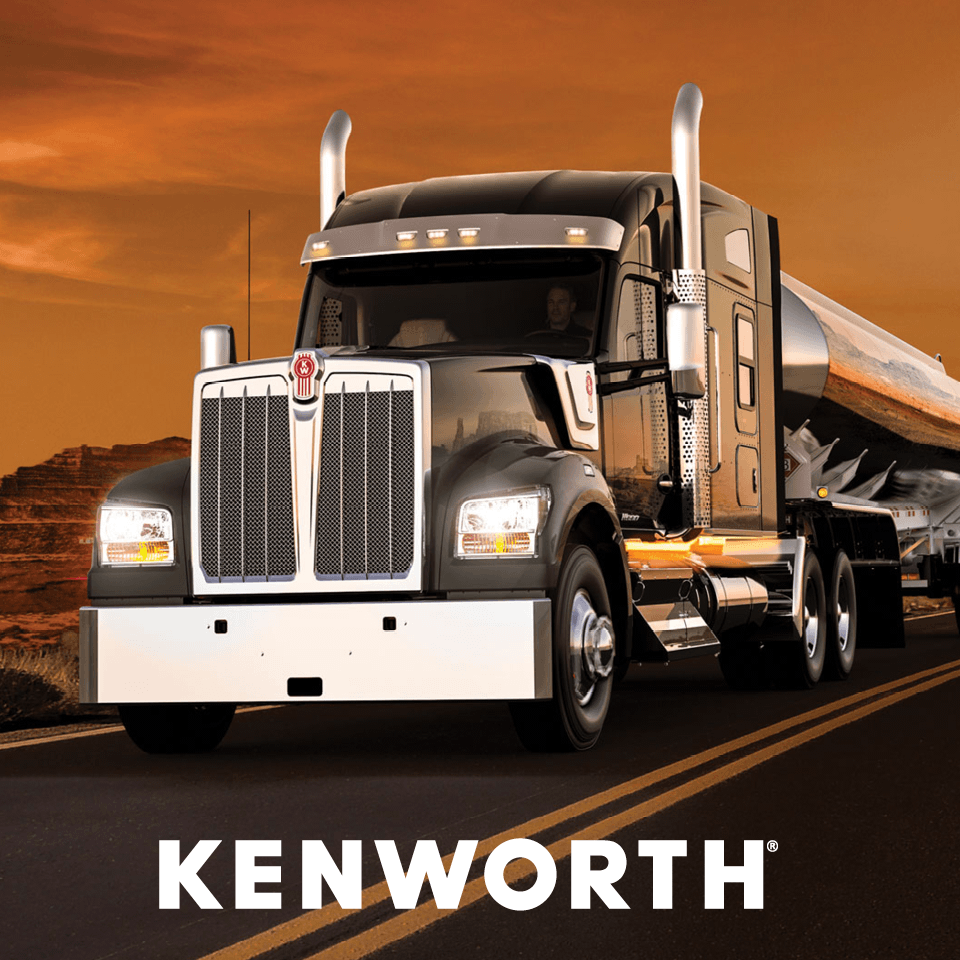Kenworth truck driving on a highway at sunset, showcasing its sleek design and robust build, ideal for long-haul transportation.