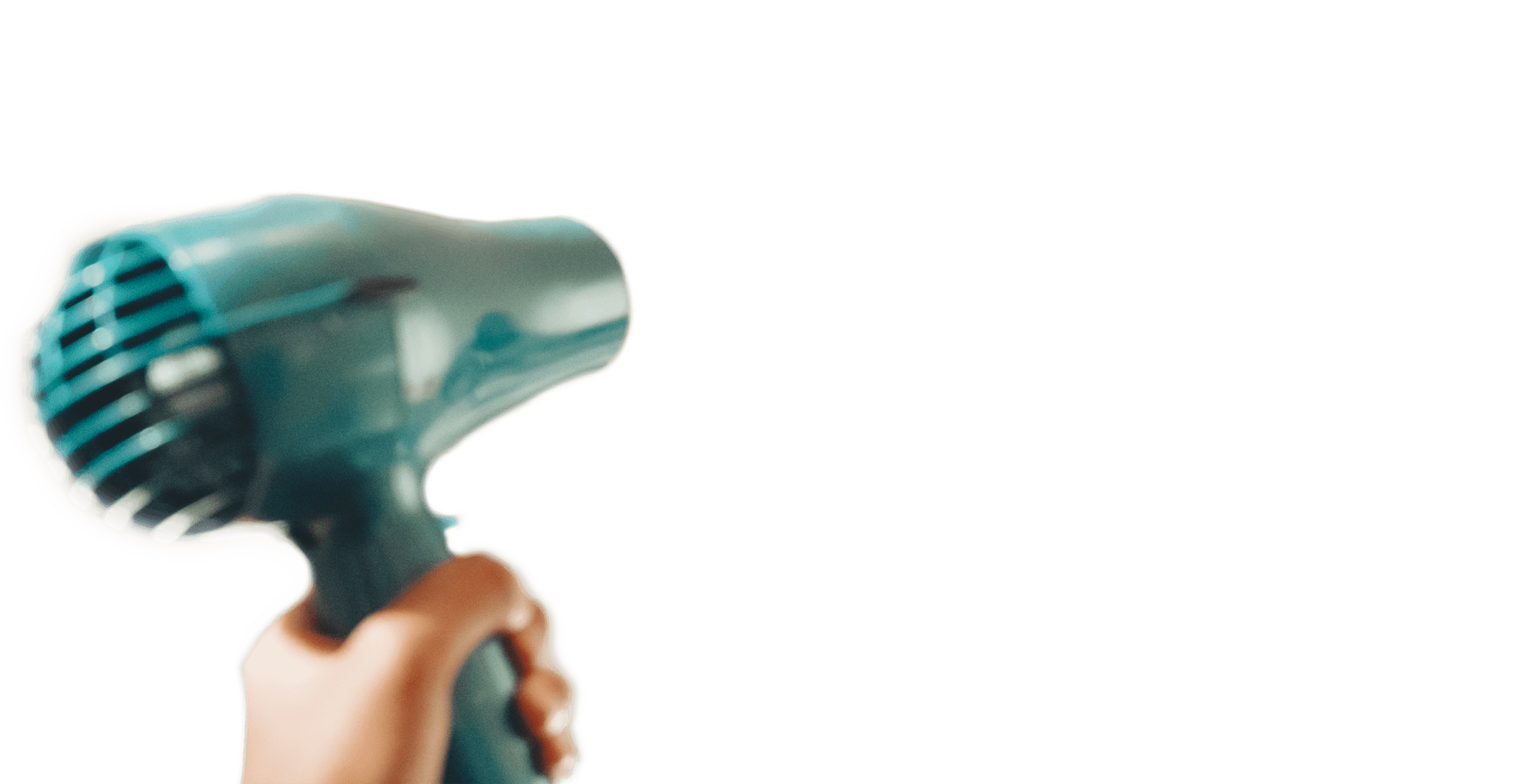 Hand holding a teal hairdryer with a focus on the nozzle and grille, ideal for hair styling and drying.