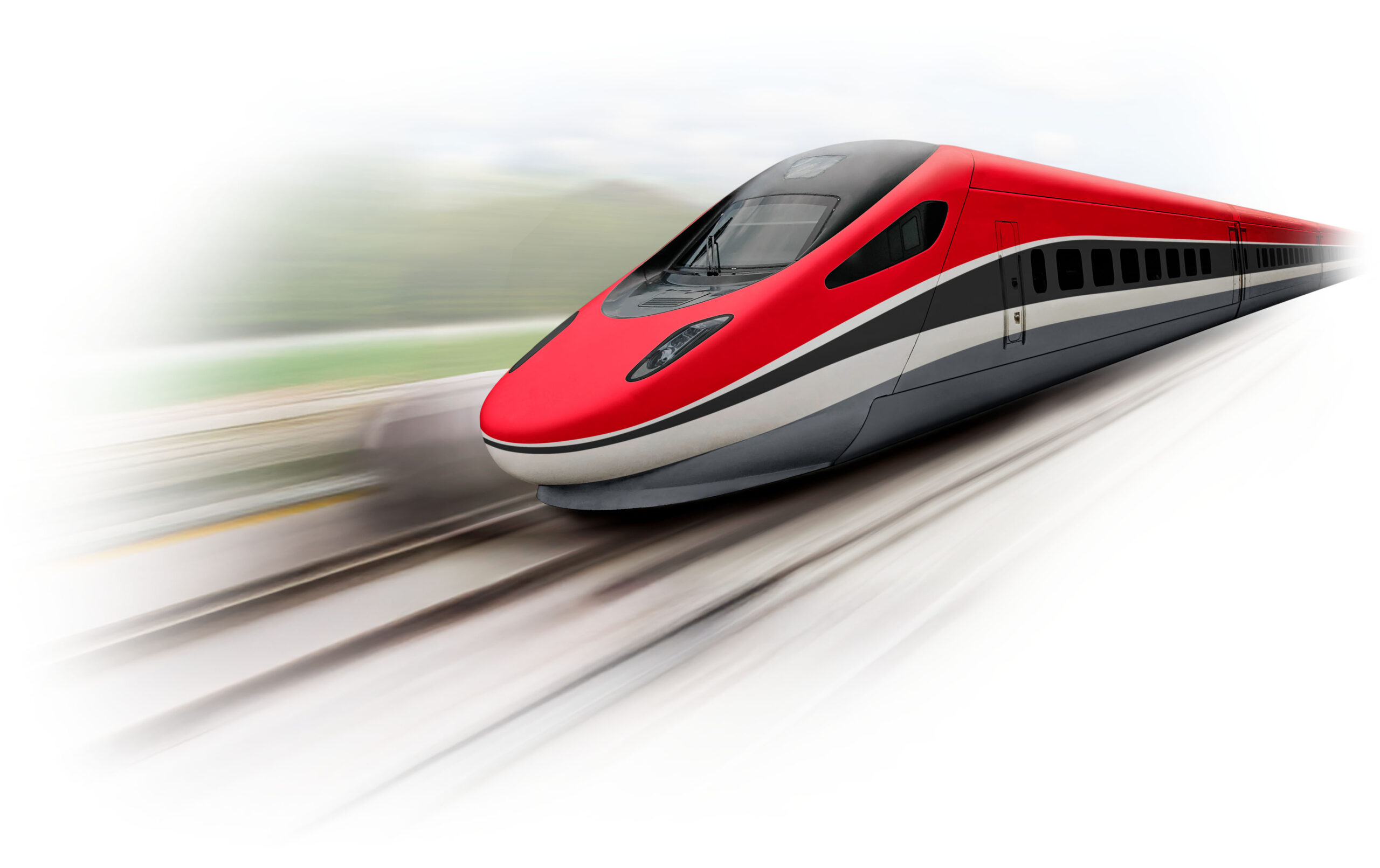 High-speed red train in motion on railway tracks, showcasing modern transportation technology and design.